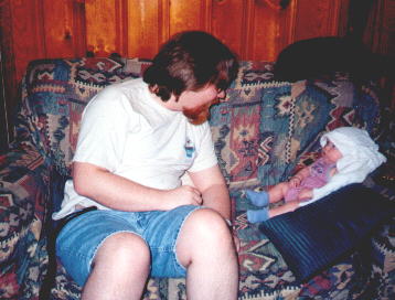 Lydia with a burp rag on her head.May 1999